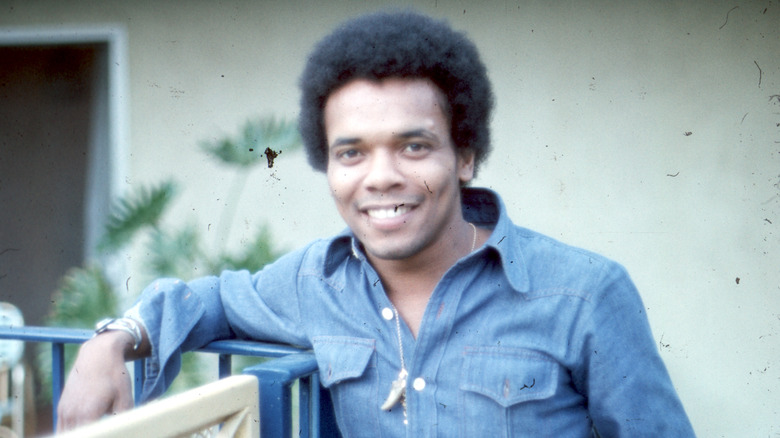 Johnny Nash smiling and posing for a photo