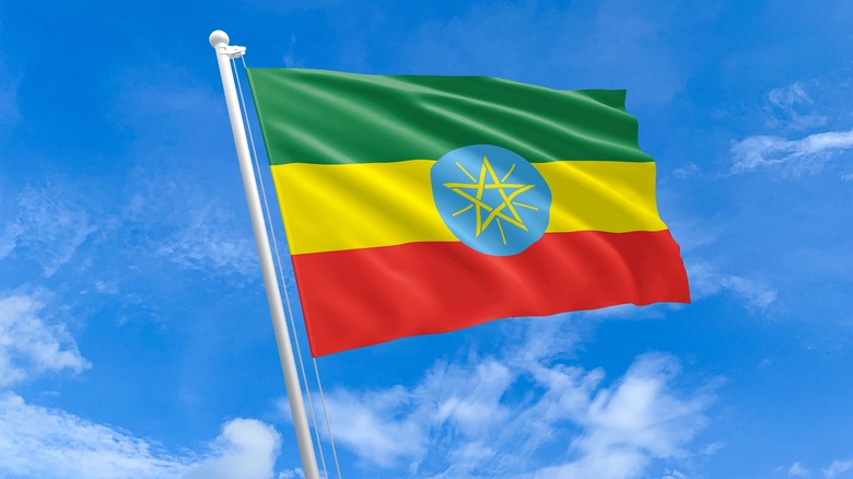 Ethiopian flag against a blue sky