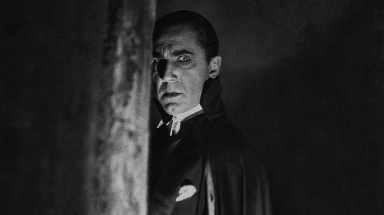 Bela Lugosi as Dracula looking around corner