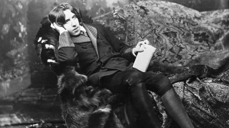 Oscar Wilde lying on couch
