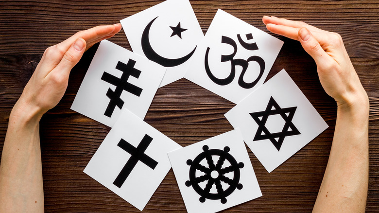 religion symbols on pieces of paper