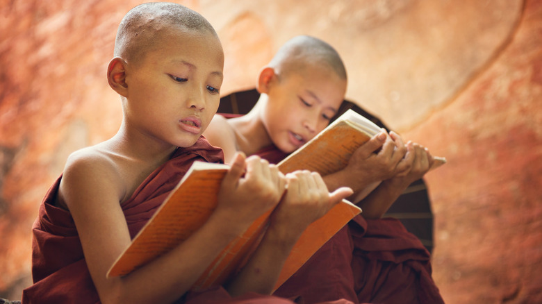 buddhist students reading