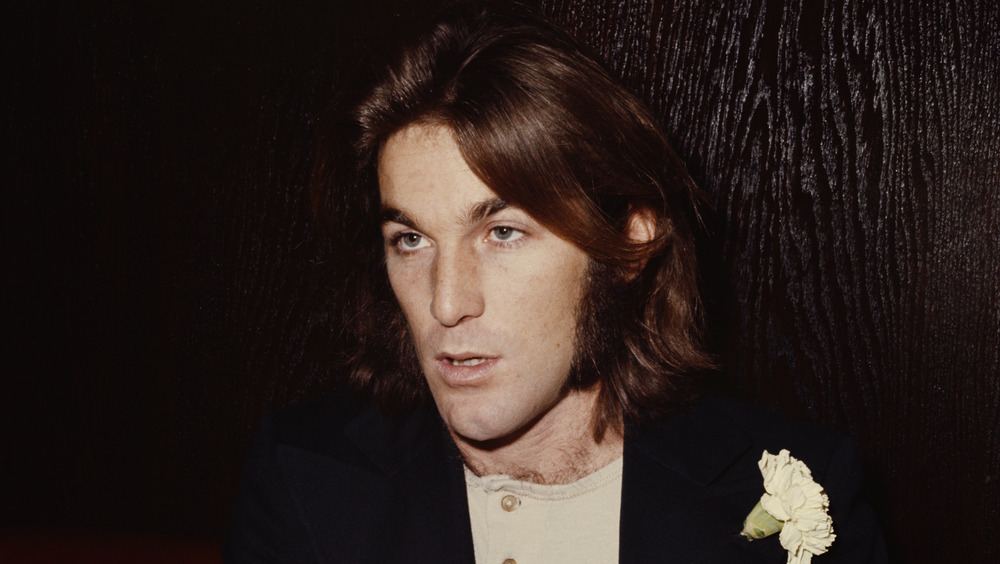 Dennis Wilson sitting at table