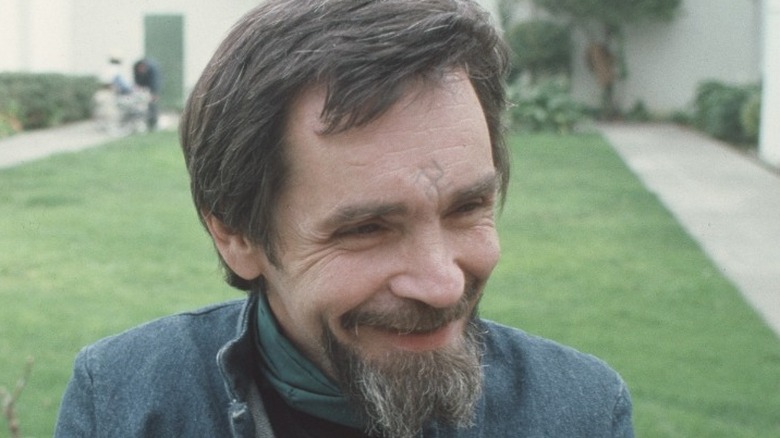 Manson smiling outside