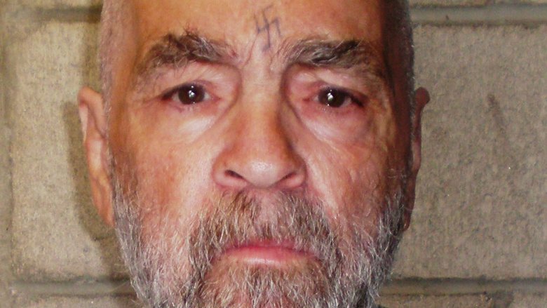 old charles manson frowning 