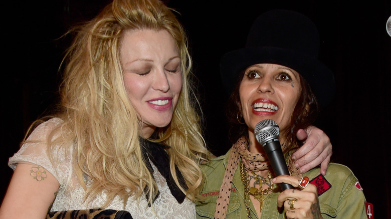 Courtney Love and Linda Perry laughing