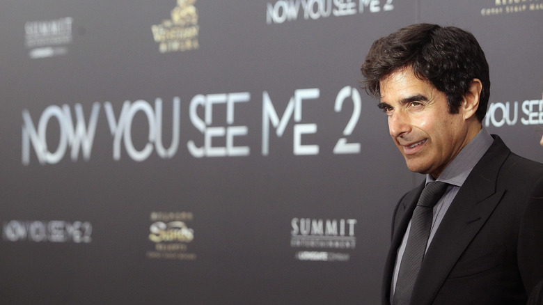 David Copperfield suit smiling at event