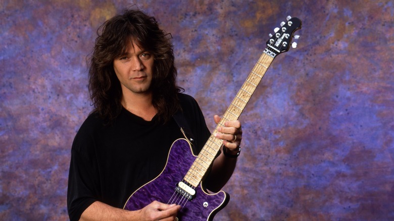 Eddie Van Halen posing on purple background 1991