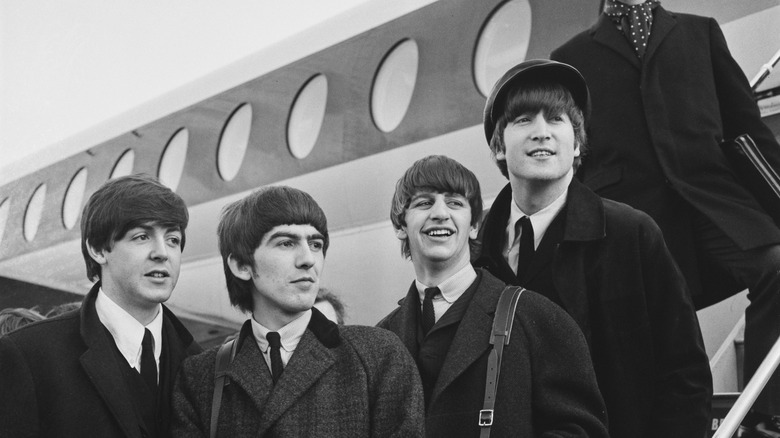 The Beatles at an airport in 1964