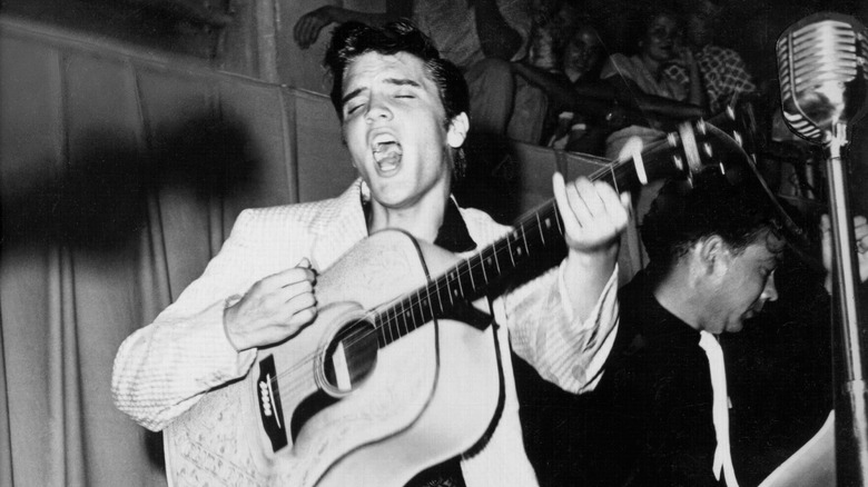 Elvis performing with guitar