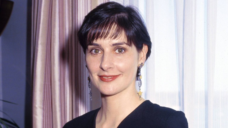 Young Enya by curtain big earrings
