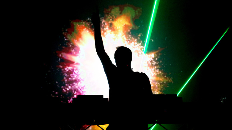 Fatboy Slim silhouette performing on stage