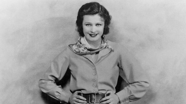 Ginger Rogers with hands on hips