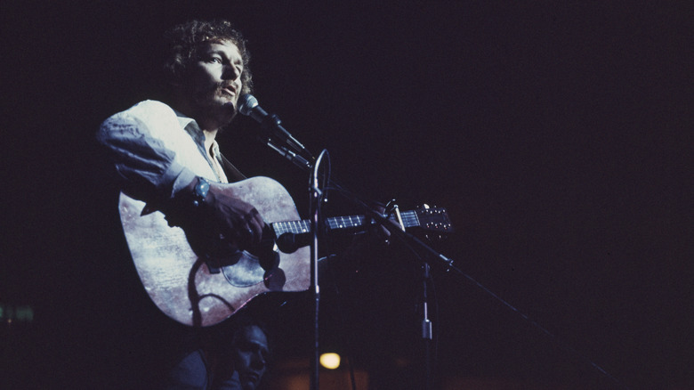 Gordon Lightfoot performing with his guitar