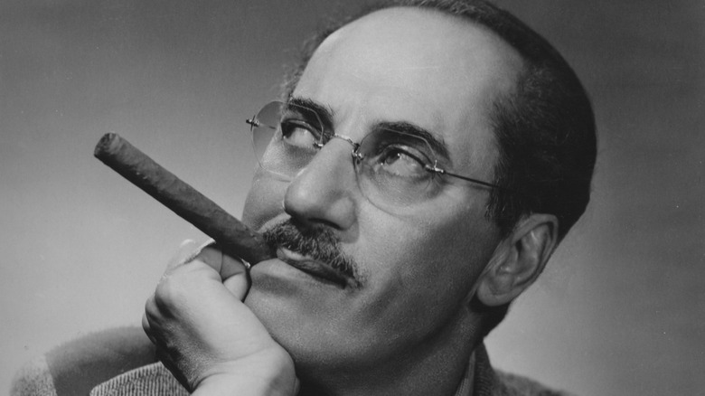 Groucho Marx chomps on a cigar