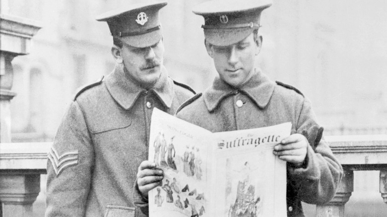 Soldiers read Suffragette newspaper 