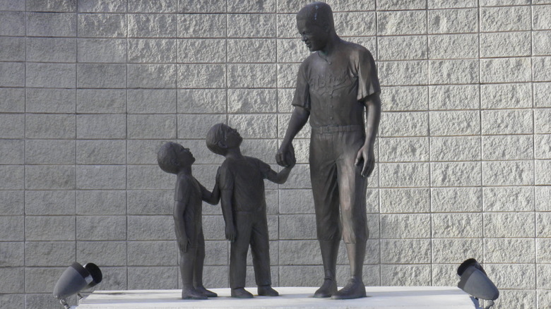 Jackie Robinson statue with children