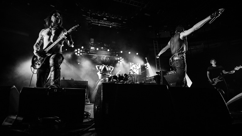 Black and white photo of Jane's Addiction performing on stage
