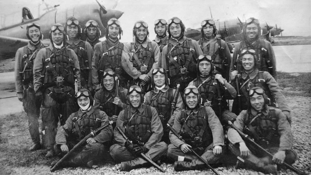 kamikaze pilots smiling in front of planes
