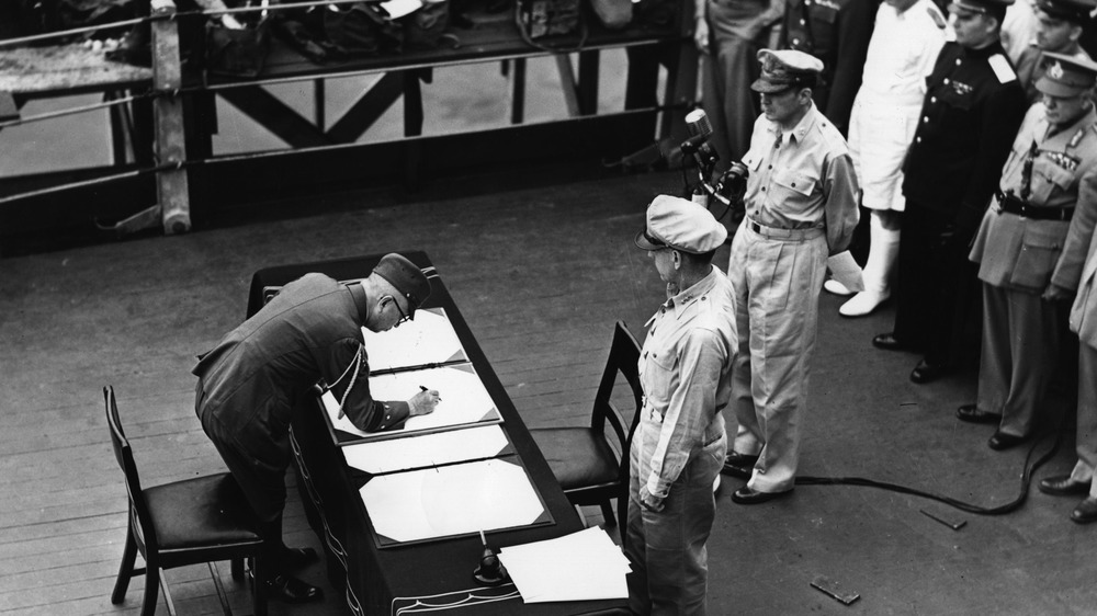 japan's surrender with man signing papers