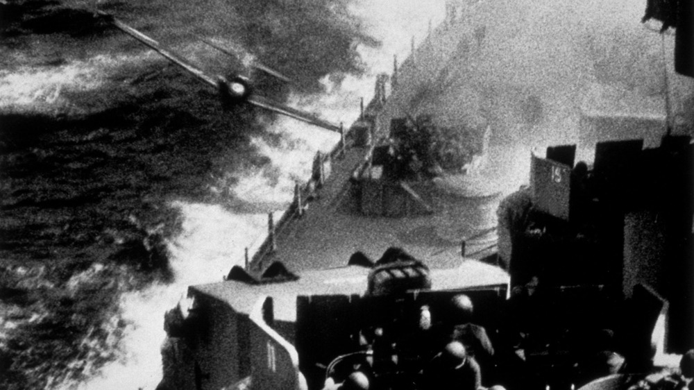 kamikaze attack with plane flying near ship