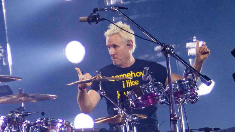 Josh Freese giving thumbs-up behind drums