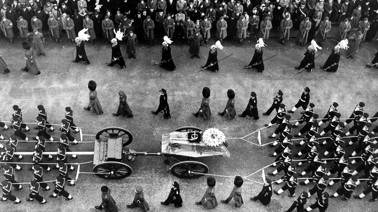 Crowds watch the procession of George VI's coffin