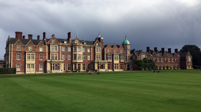Sandringham House catches a beam of sun on a cloudy day