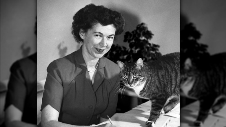 Beverly Cleary at desk writing smiling cat