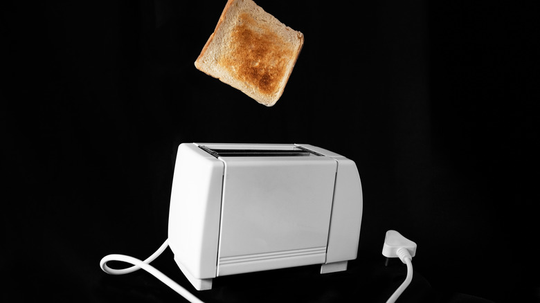 Electric toaster with popped toast