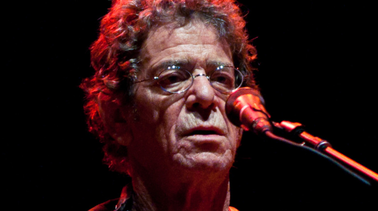 Lou Reed performing with guitar