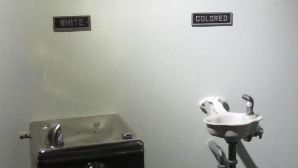 Water fountains for white and colored people, exhibited in the Levine Museum of the New South