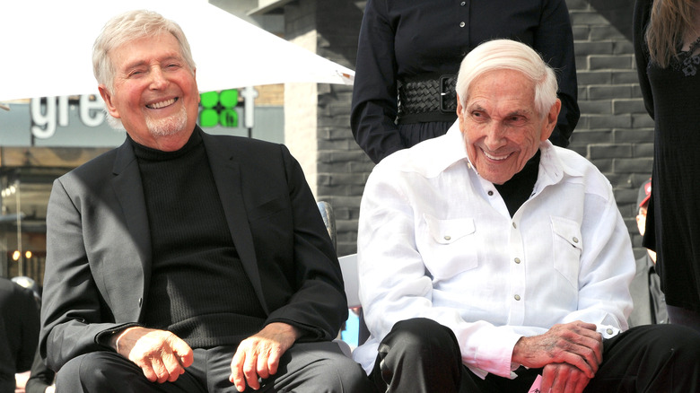 Sid and Marty Krofft sitting smiling 