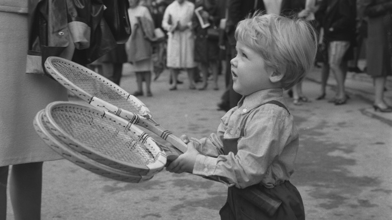Young Lars Ulrich with tennis rackets
