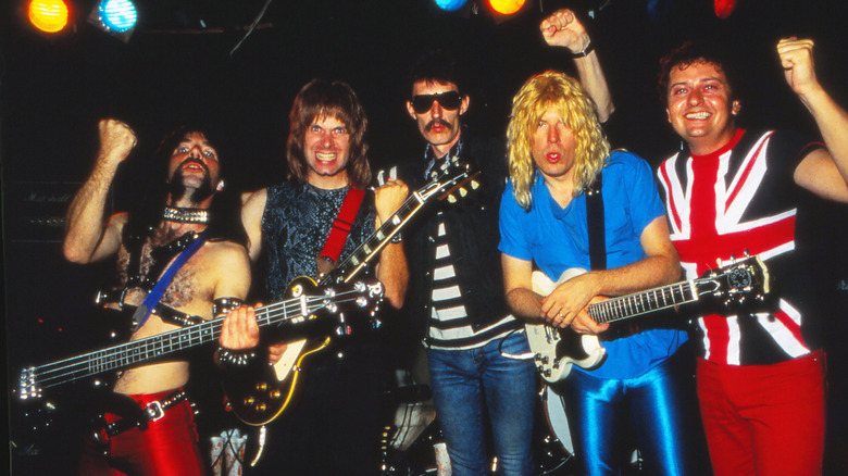 Spinal Tap posing on stage