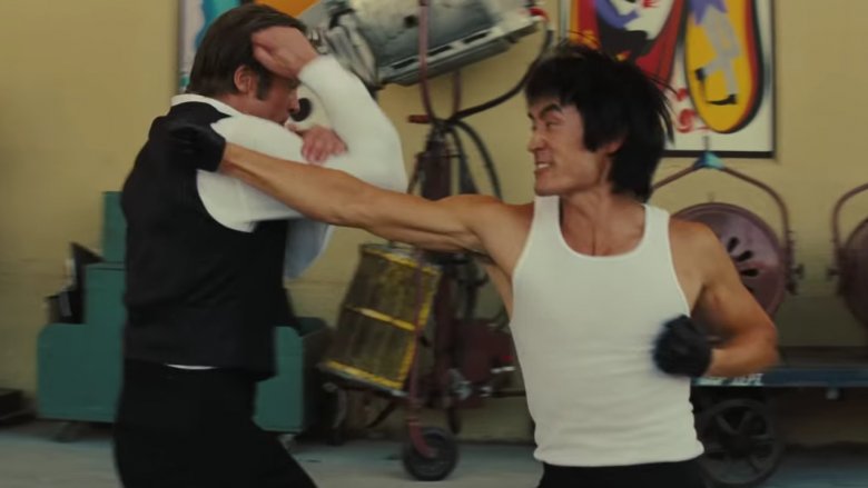 Brad Pitt as Cliff Booth and Mike Moh as Bruce Lee
