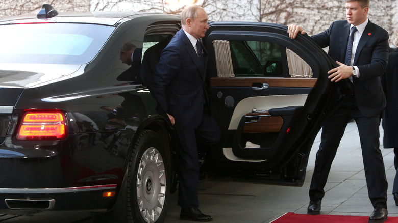 Vladimir Putin getting out of a car