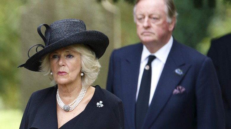 Camilla and Andrew Parker Bowles looking serious