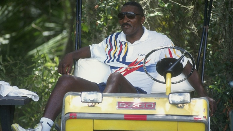 Richard Williams sitting on golf cart