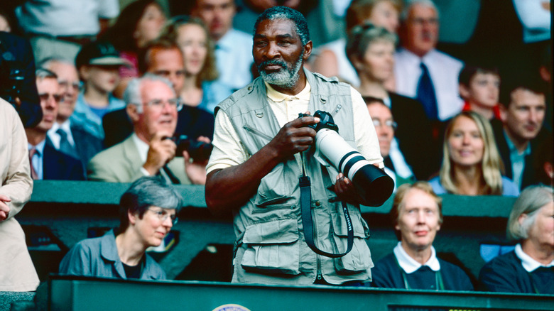 Richard Williams holding camera in stand