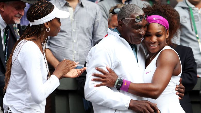 Venus, Richard, and Serena Williams hugging