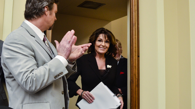 Sarah Palin walking through a door