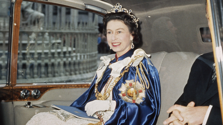 Queen Elizabeth riding in car