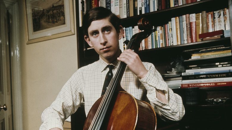 young Prince Charles playing cello