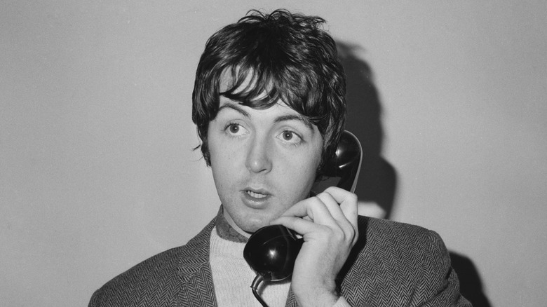 Paul McCartney speaking on a telephone