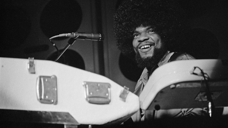Billy Preston seated at a keyboard smiling