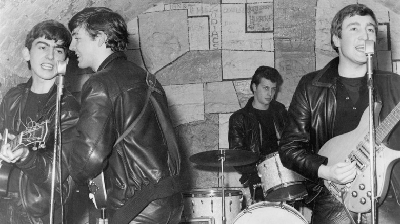 The Beatles onstage in leather jackets