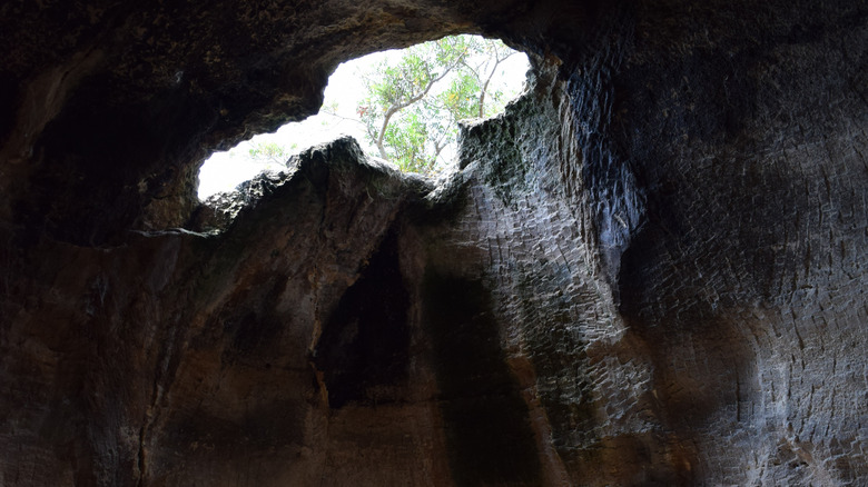 Sunlit hole in roof of cave