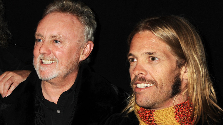 Roger Taylor and Taylor Hawkins smiling 