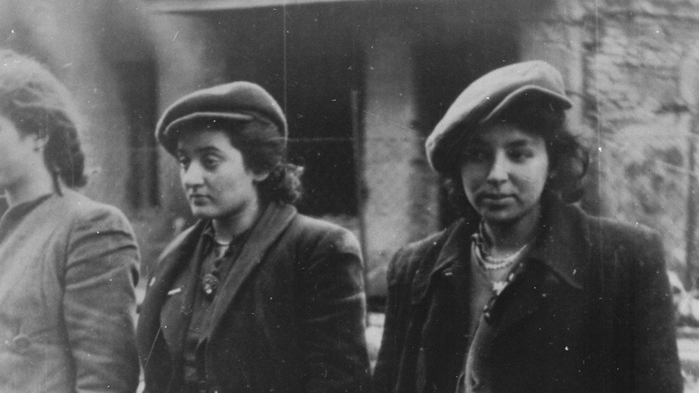 Women prisoners wearing berets 